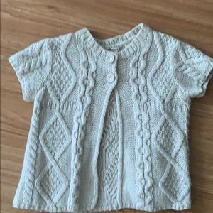 Tan cable knit short sleeve sweater with 2 buttons